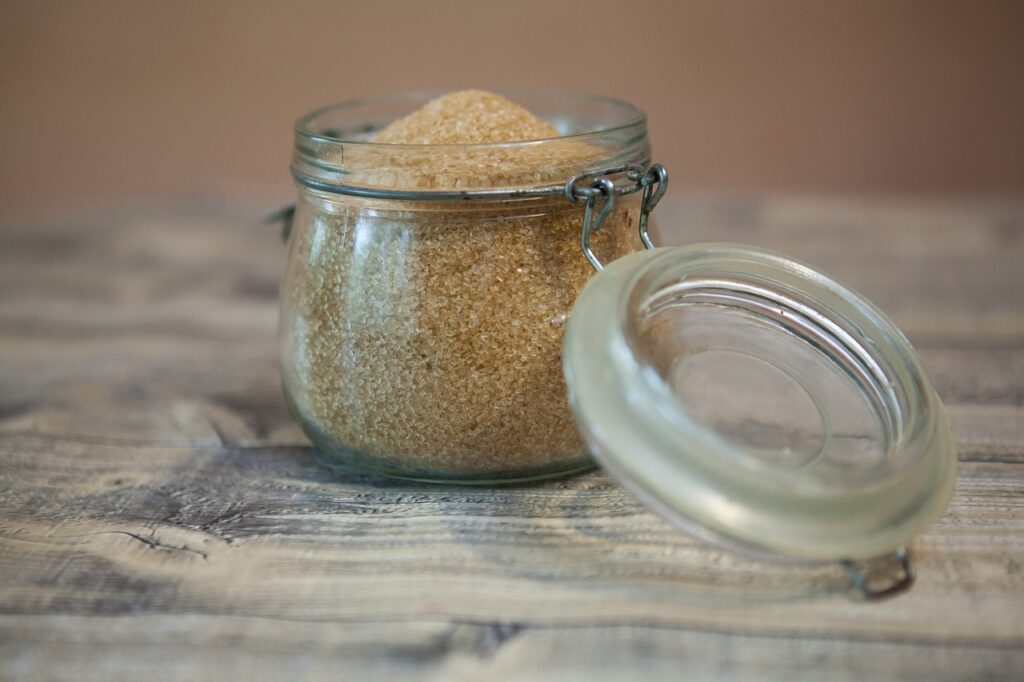 a small glass jar filled with brown sugar
